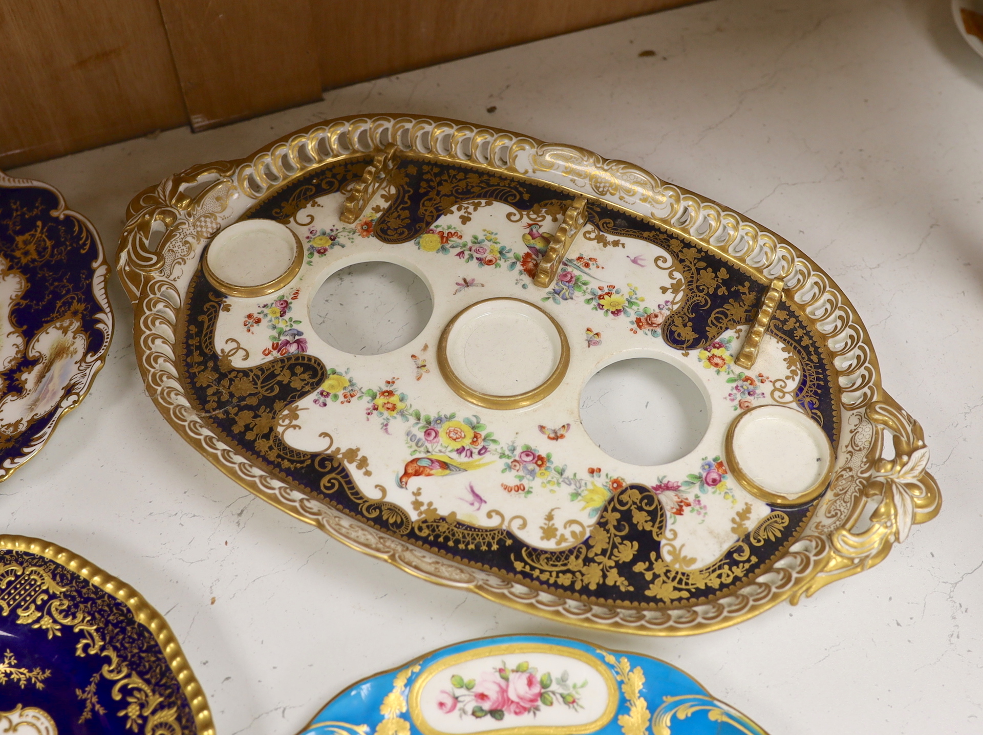 Four 19th century Coalport plates, a Coalport dish, a Minton plate, a Coalport inkstand in Chelsea style and a Derby cache pot, ink stand 40cms wide